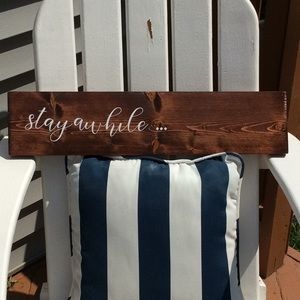 Wood sign stay awhile